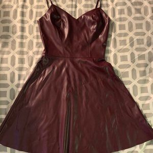Faux leather mini dress by Aqua. Size XS. Color burgundy.